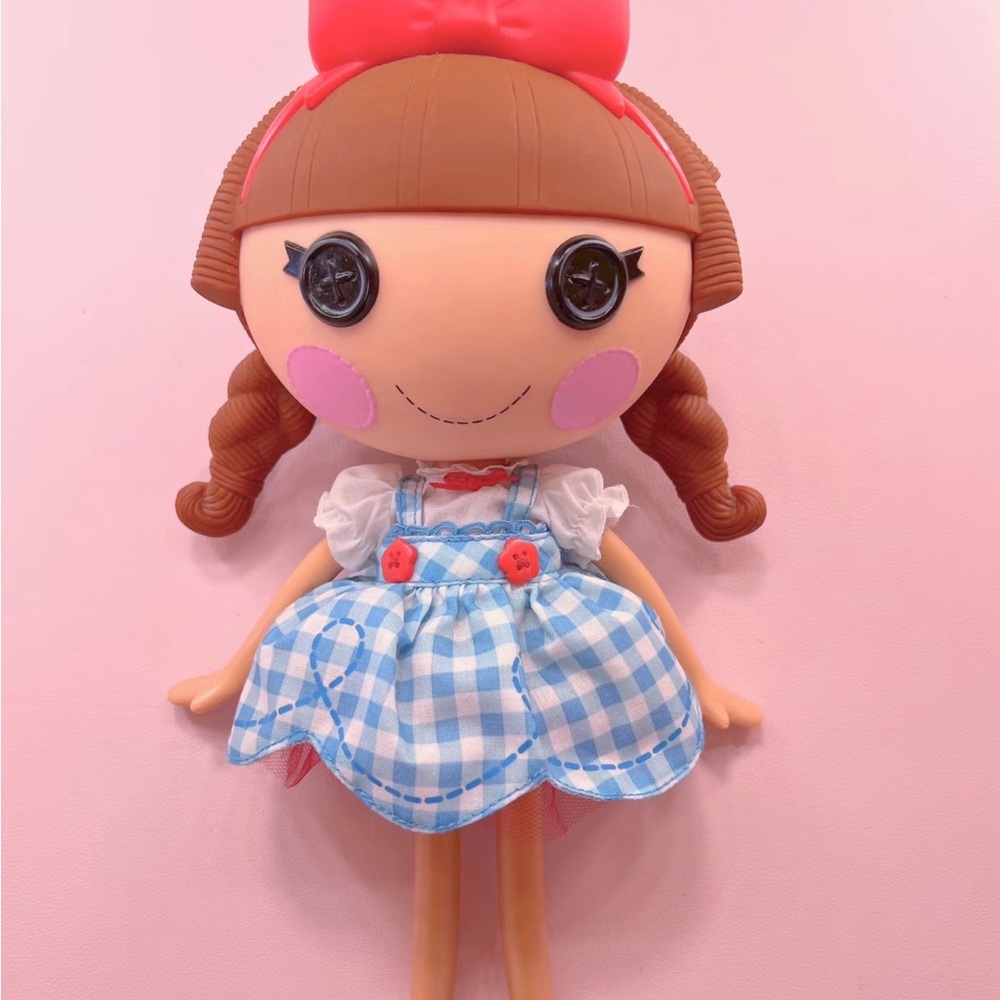 Cute Doll with Blue Dress and Red Bow